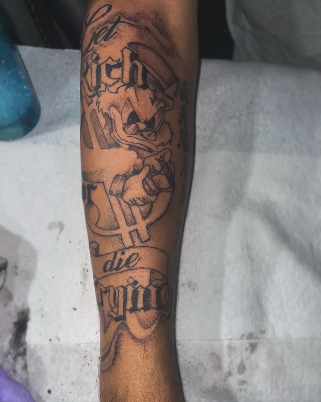 Black & Grey + Cartoon scrooge mcduck tattoo on Forearm by 4oeMag_Tattoos on TattMe