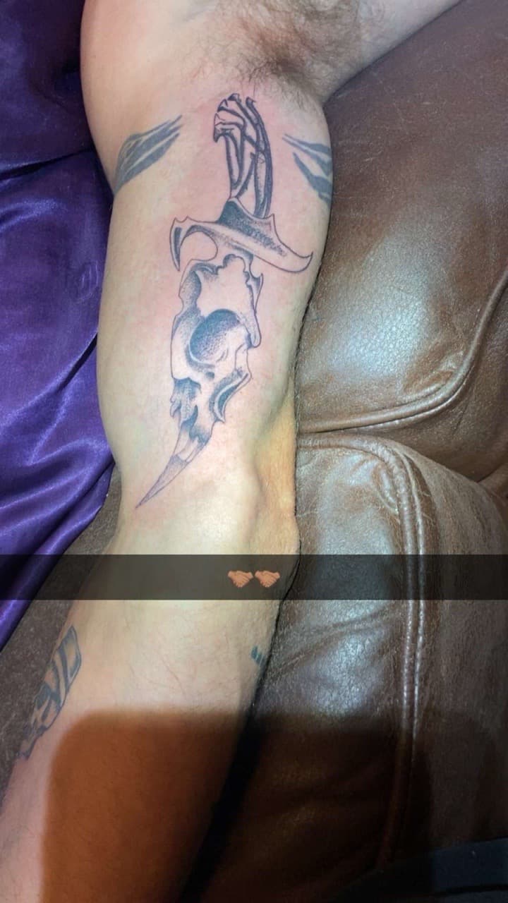 Black & Grey + Illustrative dagger tattoo on Upper Arm by The_plug_Tattoo._Co on TattMe