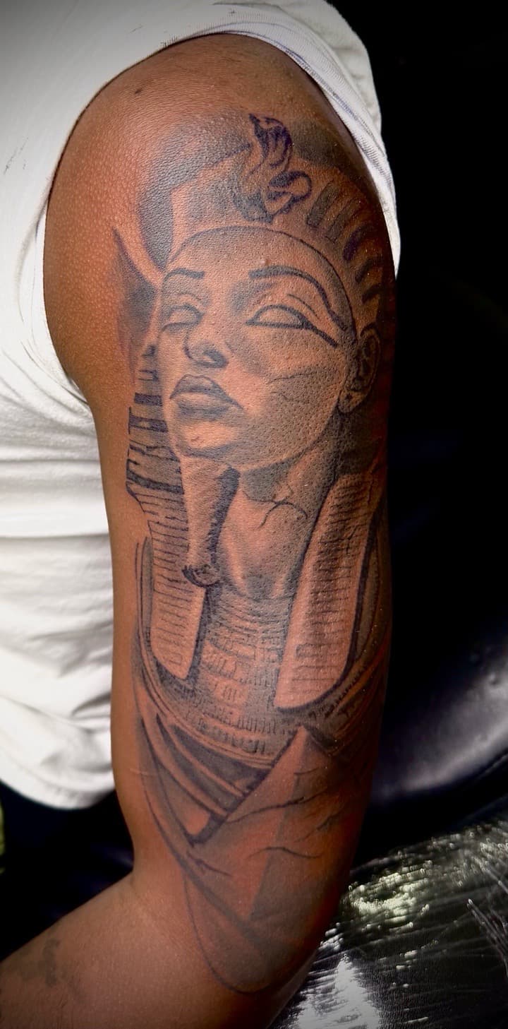 Black & Grey + Illustrative pharaoh tattoo on Upper Arm by TNO_INK on TattMe