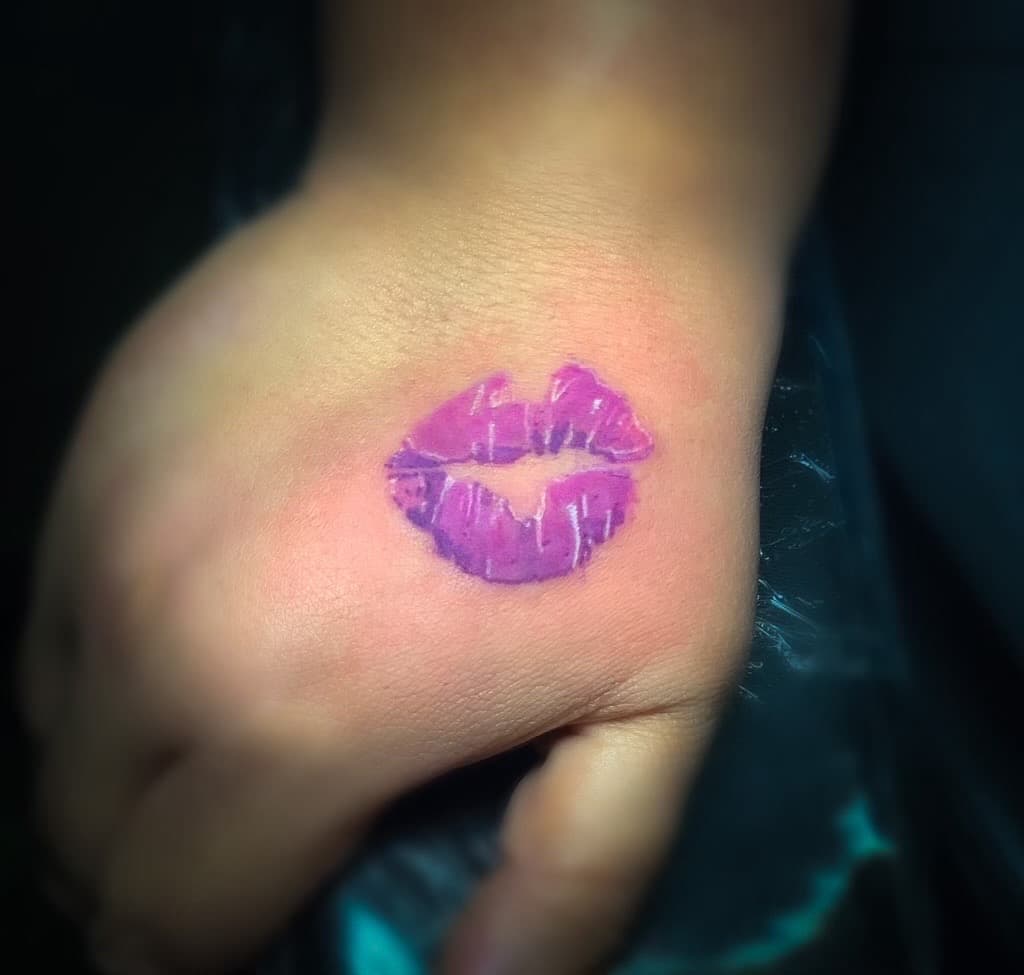 Color + Minimalist lips tattoo on Hand by TNO_INK on TattMe