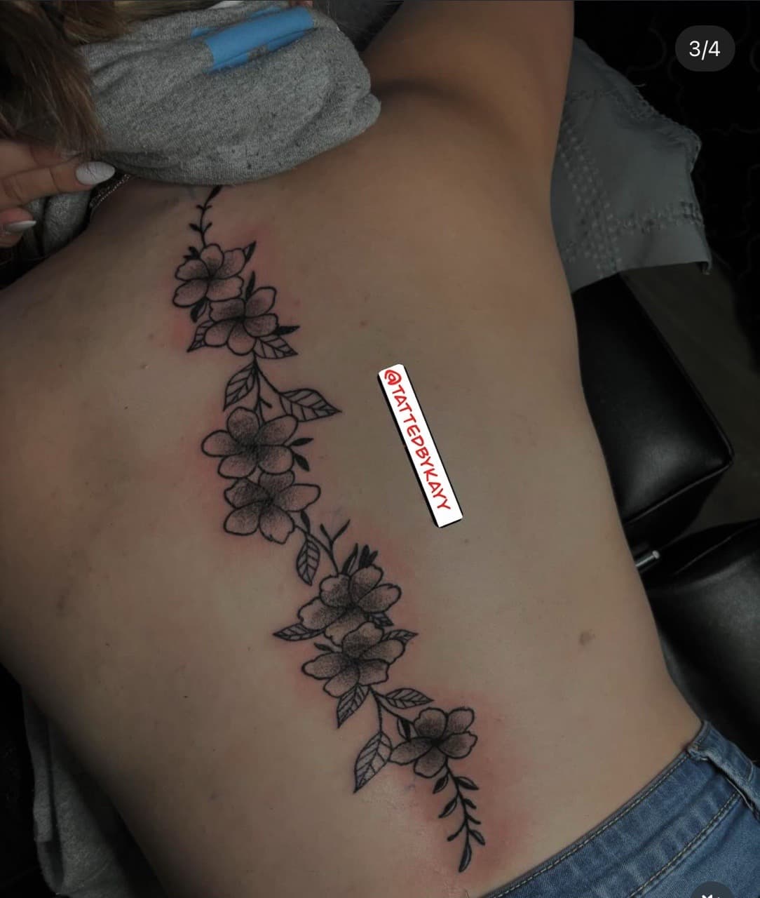 Floral + Black-work flowers tattoo on Spine by tattedbykayy on TattMe