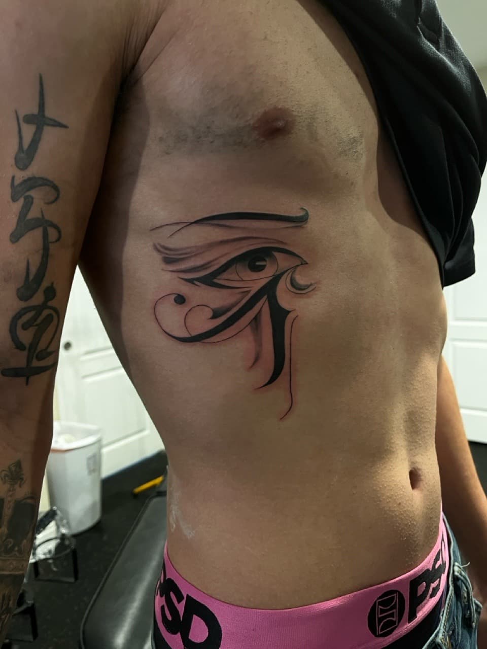 Black & Grey + Abstract eye tattoo on Ribs by Zay_Inkz on TattMe