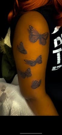Black & Grey + Illustrative butterflies tattoo on Upper Arm by Torian_Benns on TattMe