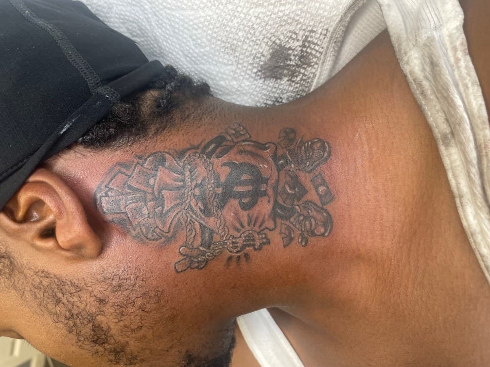 Black & Grey + Illustrative money bag tattoo on Neck (Side) by Torian_Benns on TattMe