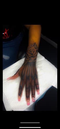 Black & Grey + Illustrative rose tattoo on Hand by Torian_Benns on TattMe