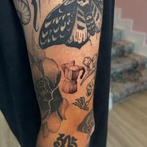 Black & Grey Cafe tattoo on Upper Arm by cozinks on TattMe