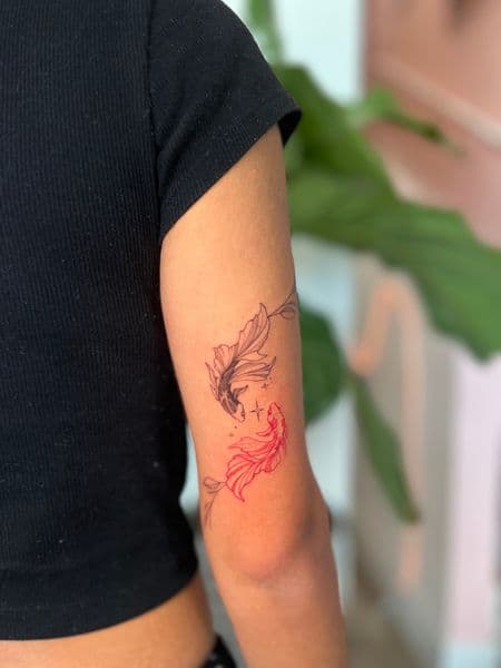 Fine Line + Minimalist fish tattoo on Upper Arm by cozinks on TattMe