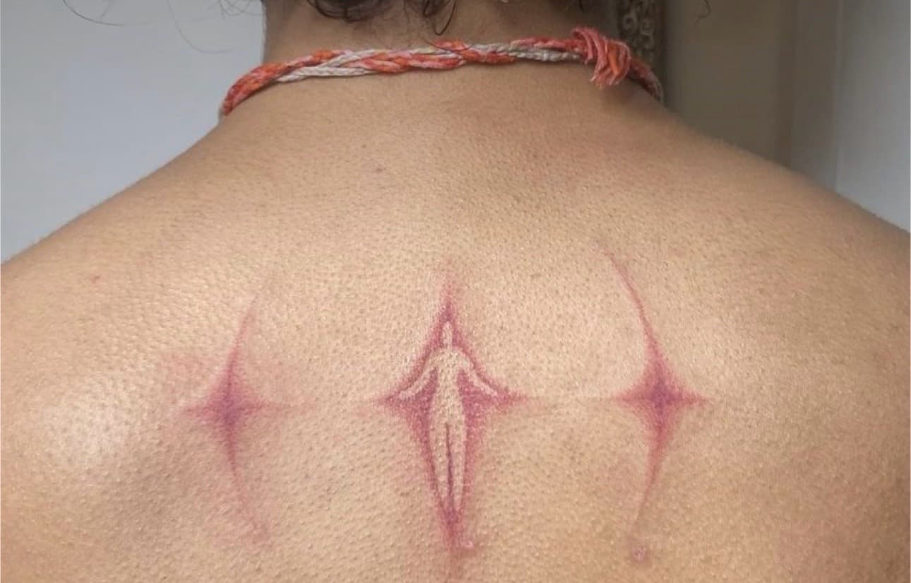 Symbolic + Abstract scarification tattoo on Upper Back by Mona_Lisa on TattMe