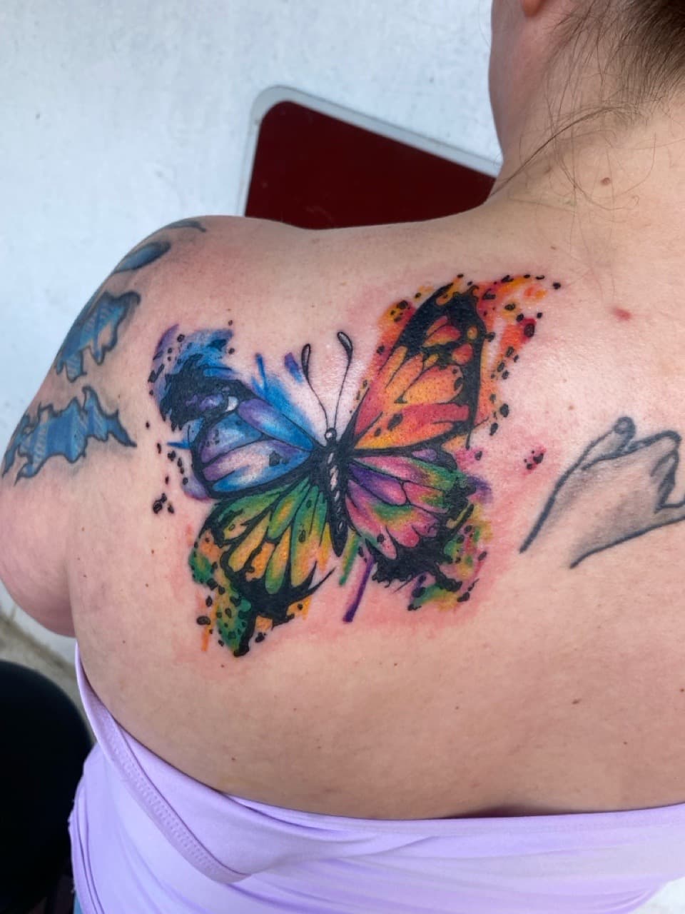 Watercolor + Color butterfly tattoo on Upper Back by Zoe_Bates on TattMe