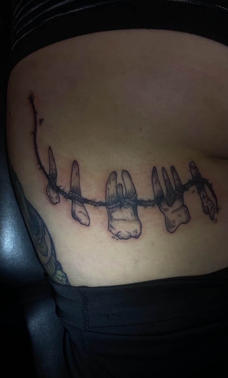 Black & Grey + Illustrative teeth tattoo on Ribs by Zoe_Bates on TattMe