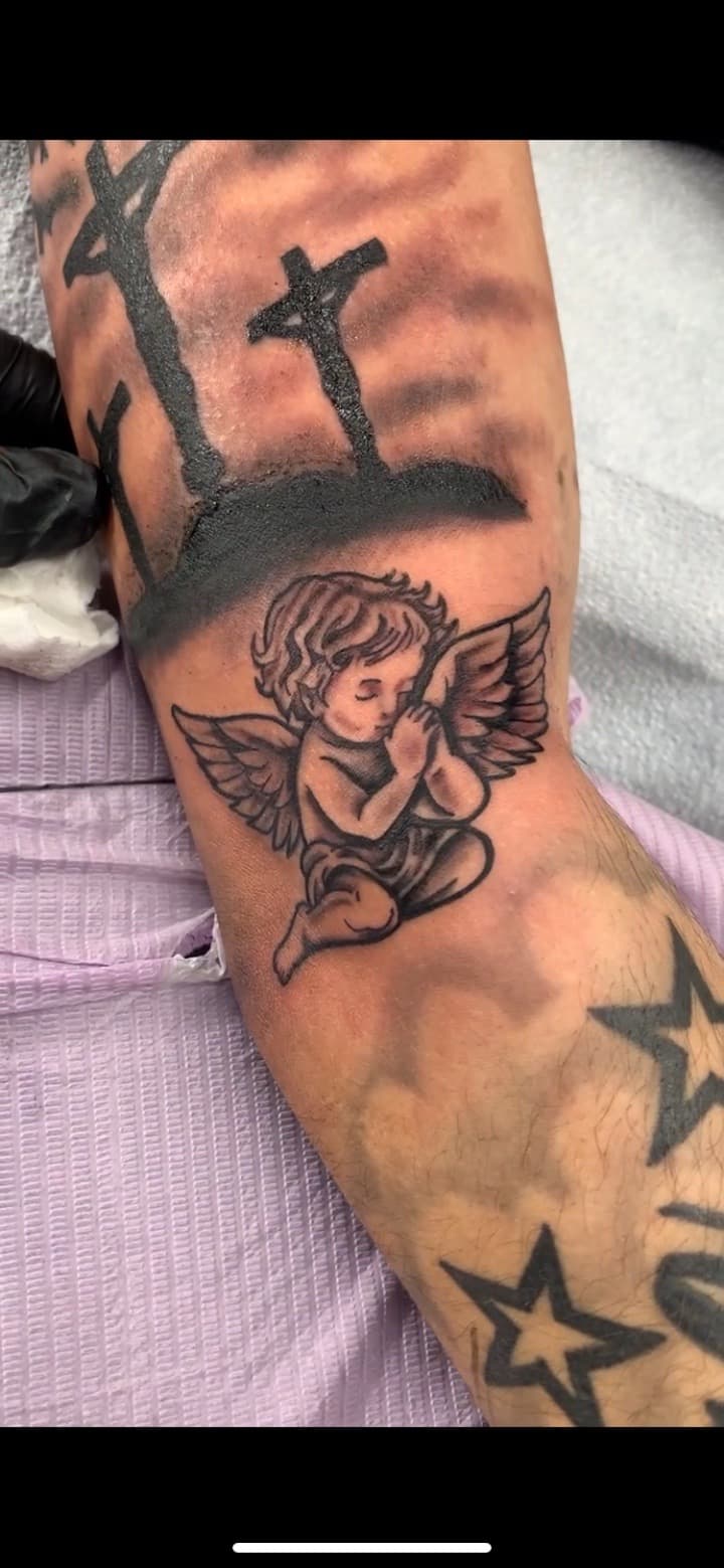 Black & Grey + Illustrative cherub tattoo on Forearm by Modest_Ink_Ellz on TattMe
