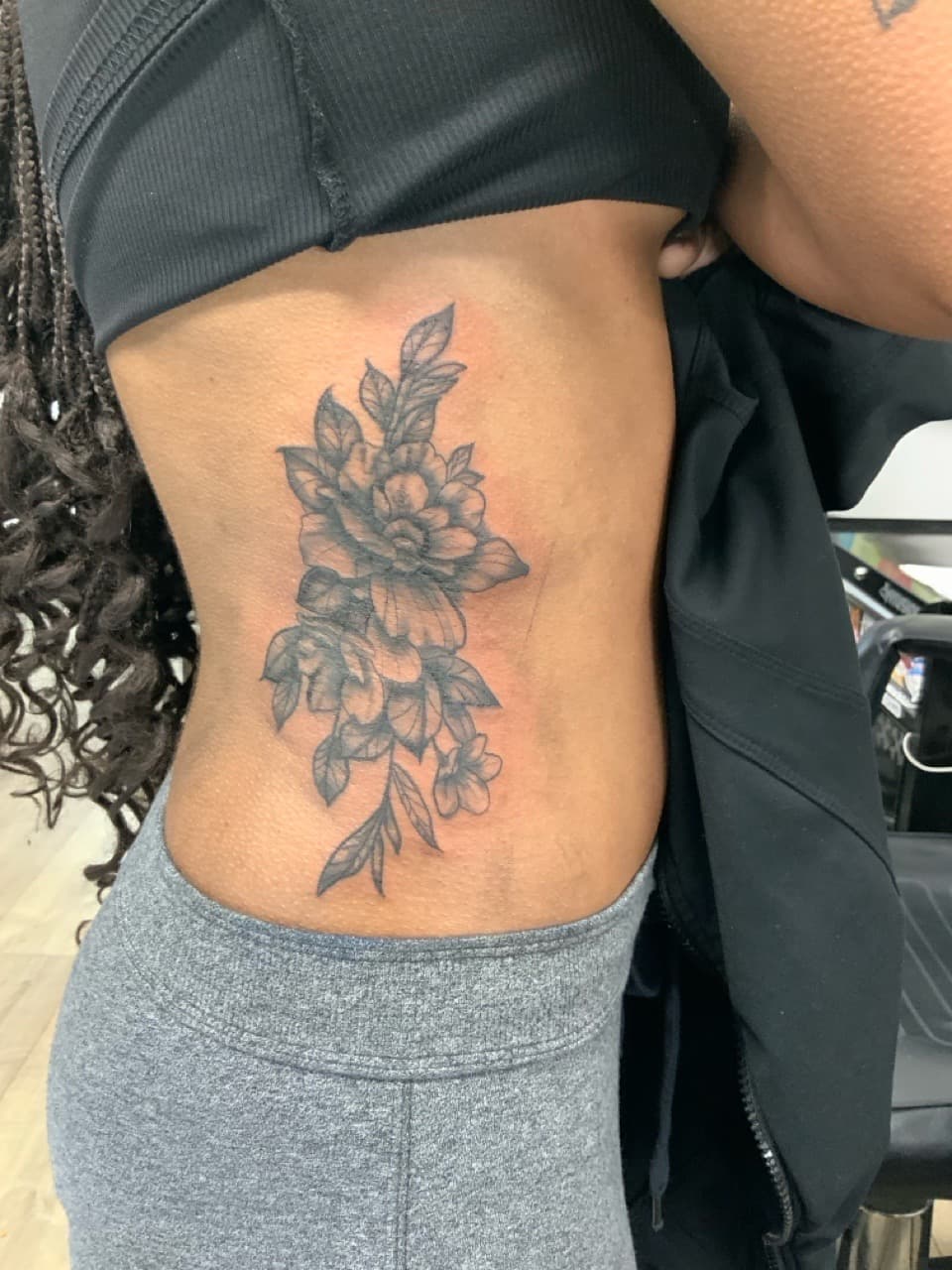 Black & Grey + Floral flowers tattoo on Ribs by Modest_Ink_Ellz on TattMe