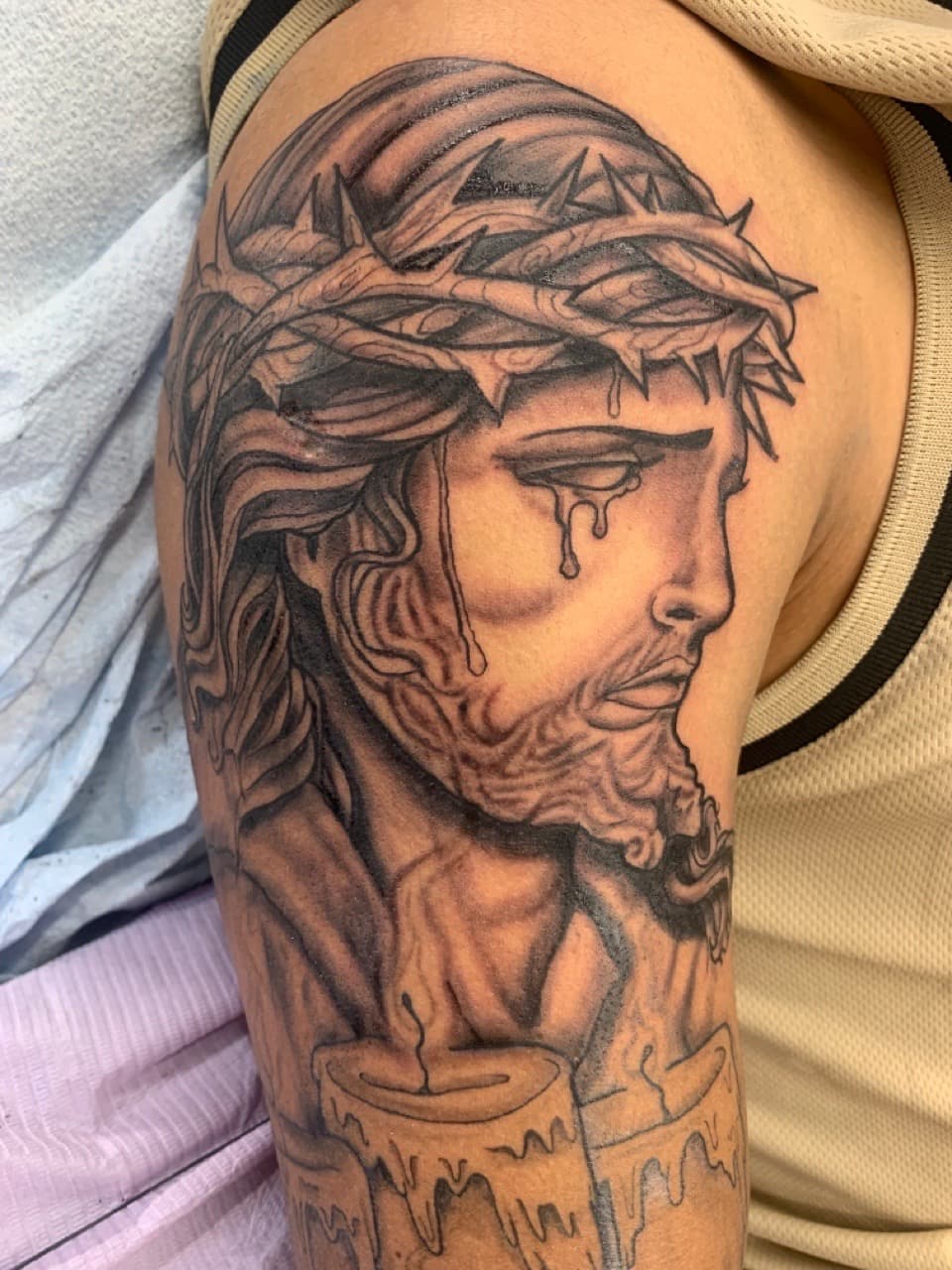 Black & Grey + Illustrative jesus tattoo on Upper Arm by Modest_Ink_Ellz on TattMe