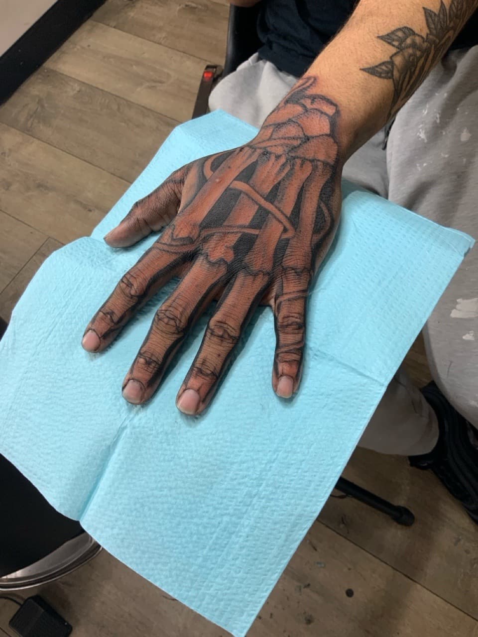 Black & Grey + Illustrative bones tattoo on Hand by Modest_Ink_Ellz on TattMe