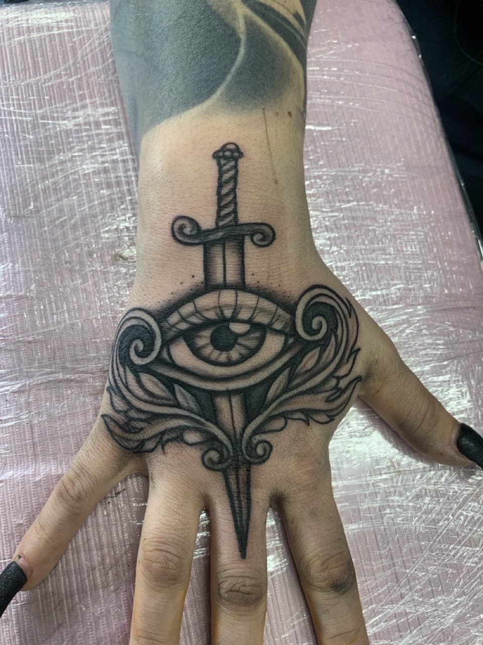 Black & Grey + Neo-Traditional sword tattoo on Hand by Modest_Ink_Ellz on TattMe