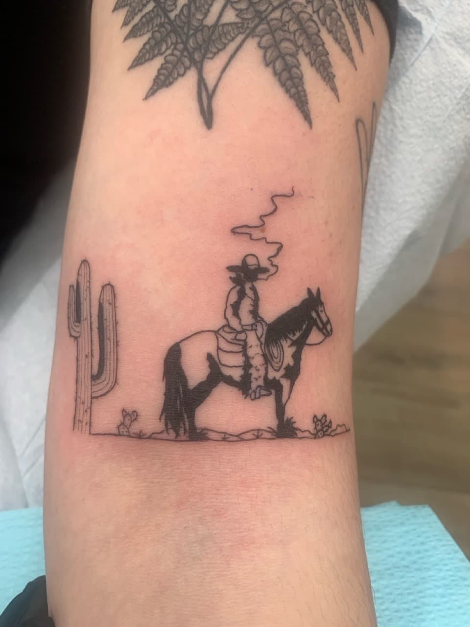 Black-work + Illustrative cowboy tattoo on Forearm by Modest_Ink_Ellz on TattMe