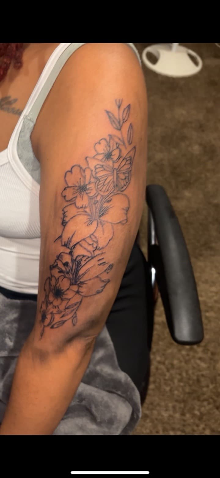 Floral + Line-work flowers tattoo on Upper Arm by Quis on TattMe