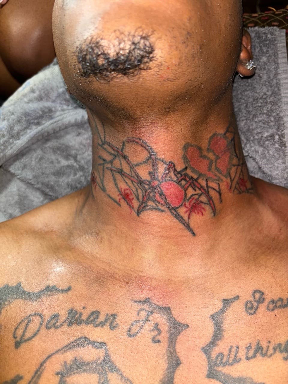 Color + Line-work spider tattoo on Neck (Front) by Quis on TattMe