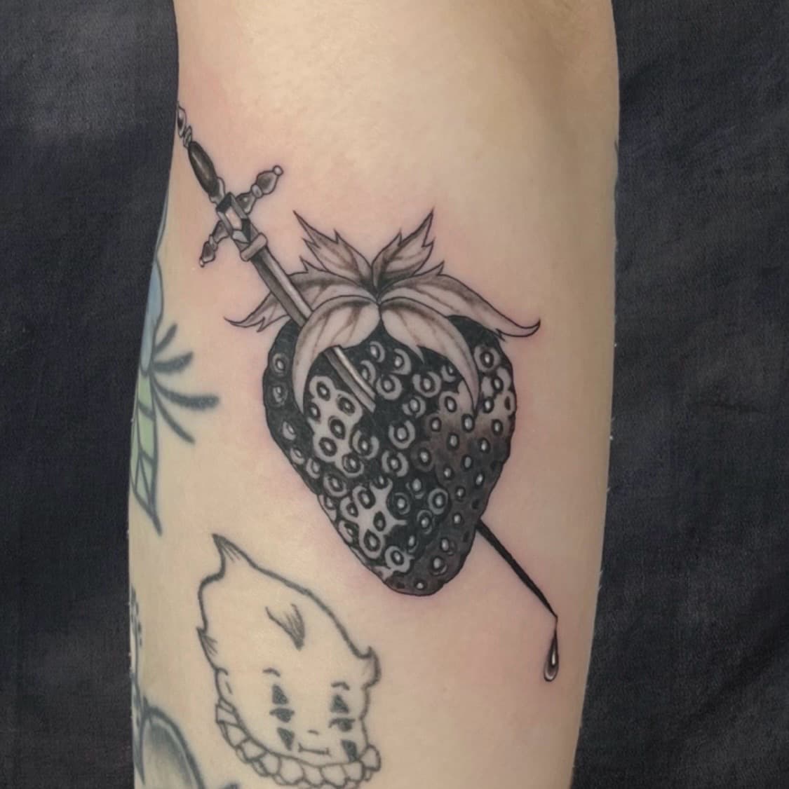 Black & Grey + Illustrative strawberry tattoo on Forearm by Adriana on TattMe