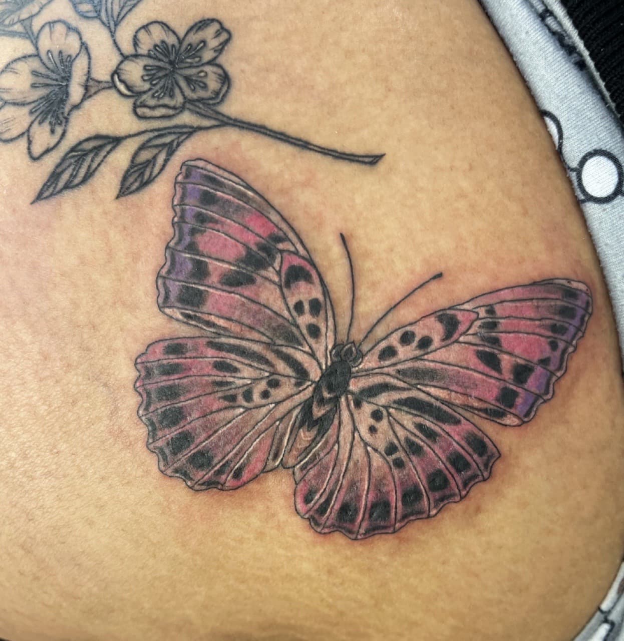 Color + Floral butterfly tattoo on Hip by Adriana on TattMe