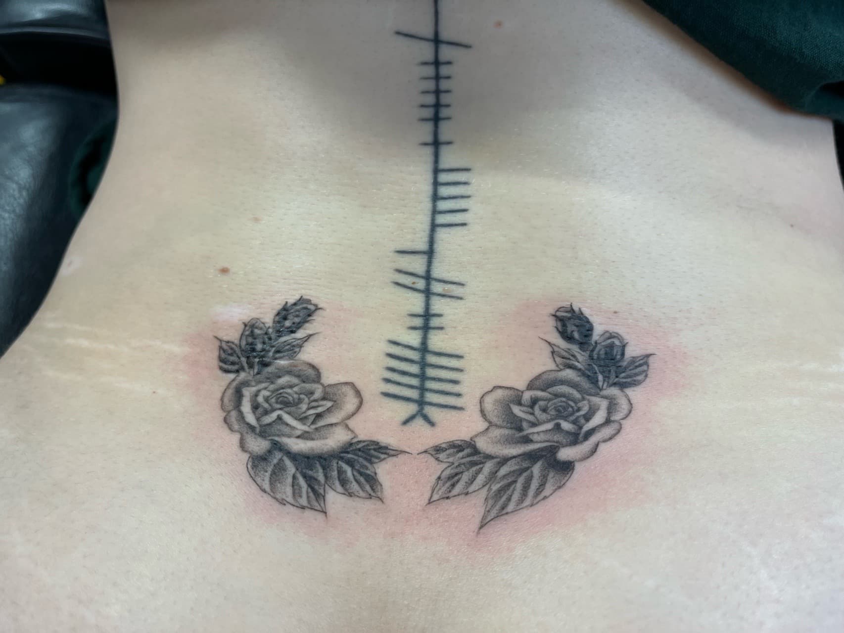 Black & Grey + Floral roses tattoo on Lower Back by Adriana on TattMe
