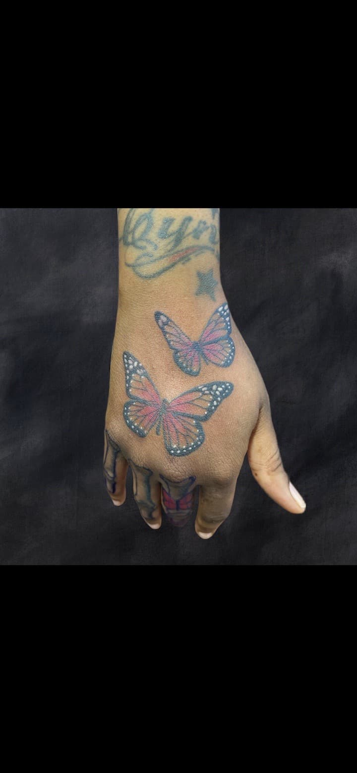 Illustrative + Color butterflies tattoo on Hand by Adriana on TattMe