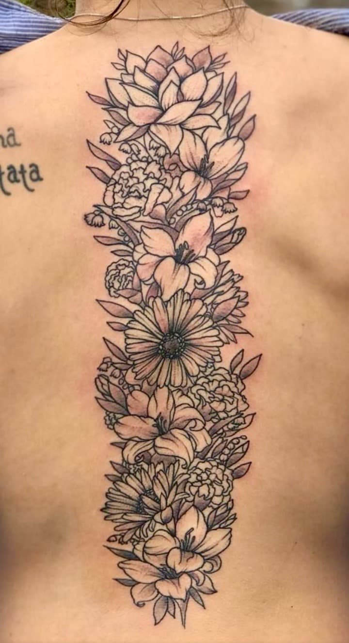 Floral + Illustrative flowers tattoo on Spine by Taking_Art_2_The_Streets_1 on TattMe