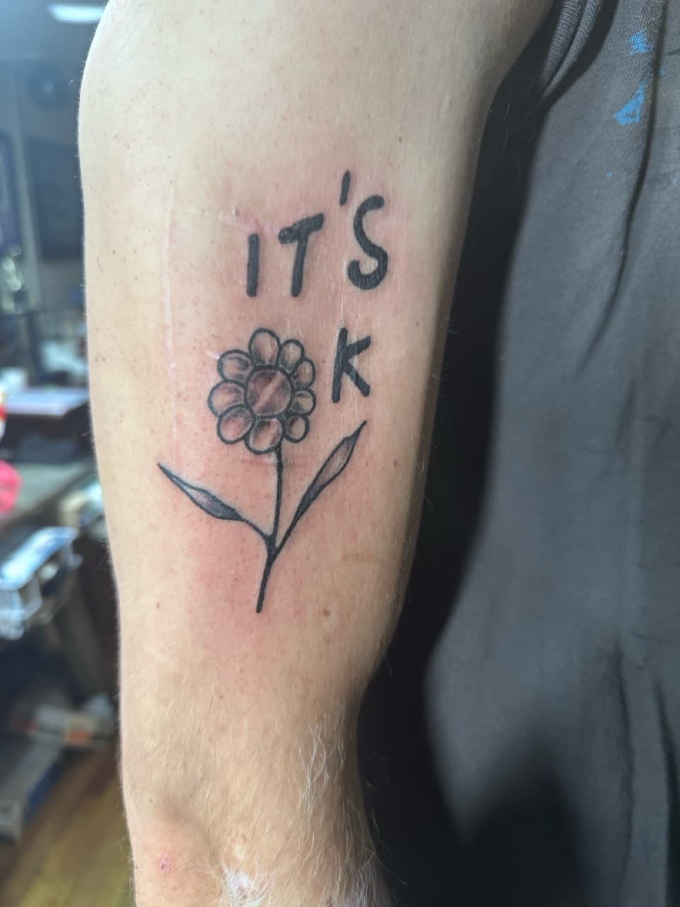 Line-work + Minimalist flower tattoo on Upper Arm by Taking_Art_2_The_Streets_1 on TattMe