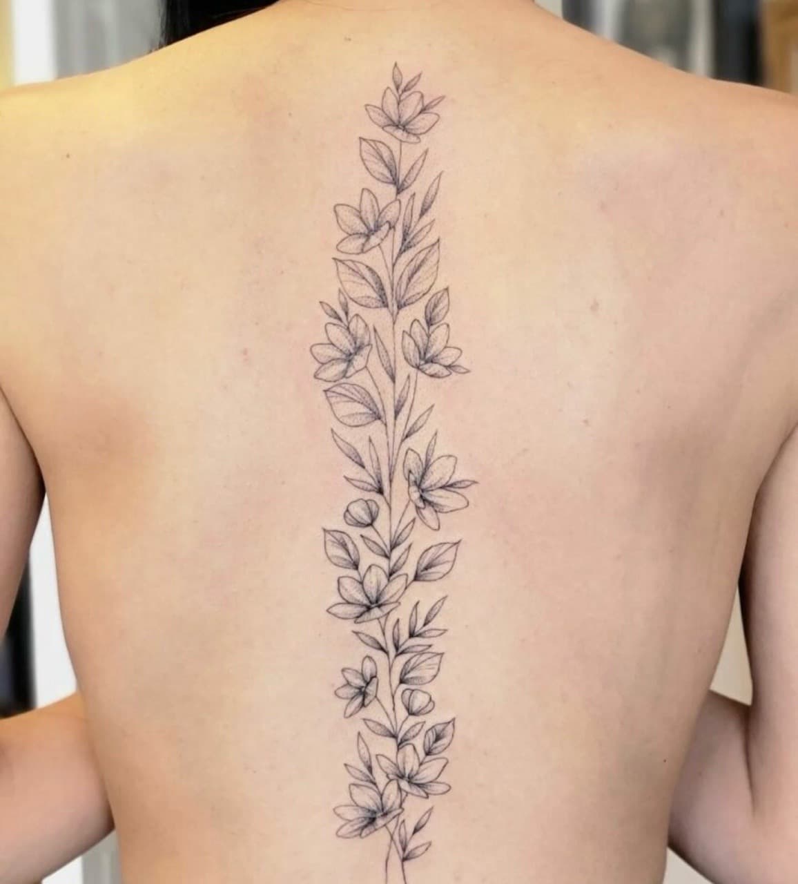 Fine Line + Floral flowers tattoo on Spine by Taking_Art_2_The_Streets_1 on TattMe