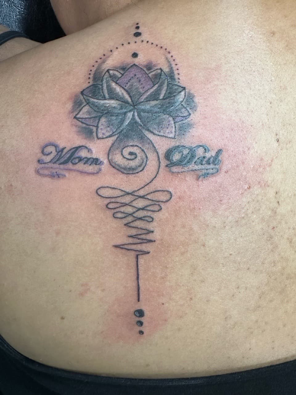 Fine Line + Black & Grey lotus tattoo on Upper Back by Taking_Art_2_The_Streets_1 on TattMe