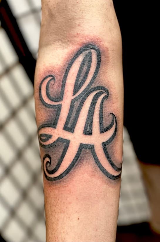 Lettering + Script LA letters tattoo on Forearm by Danny_Orellana on TattMe