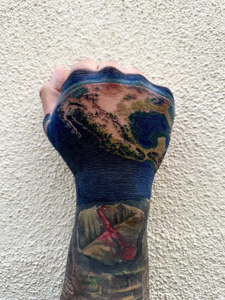 Realism + Color earth tattoo on Hand by Danny_Orellana on TattMe