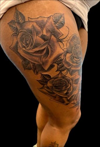 Floral + Black & Grey roses tattoo on Thigh by Blessed_Ink_Therapy on TattMe