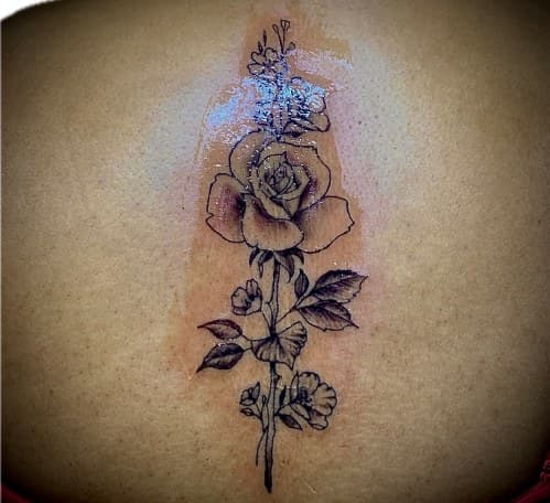 Fine Line + Floral rose tattoo on Spine by Blessed_Ink_Therapy on TattMe