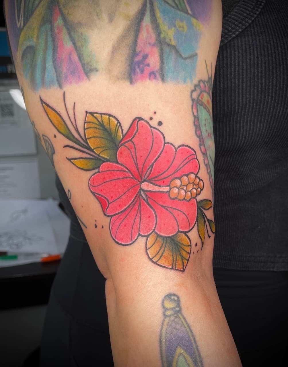 Traditional + Color hibiscus tattoo on Upper Arm by Dark_Alchemy_Studios on TattMe