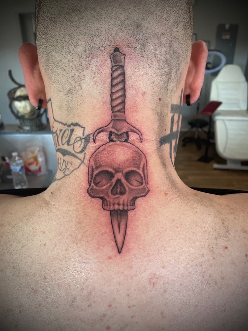 Black & Grey + Illustrative skull tattoo on Neck (Back) by Dark_Alchemy_Studios on TattMe