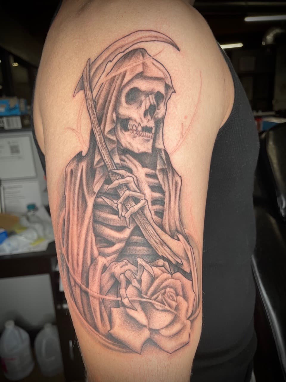 Black & Grey + Illustrative grim reaper tattoo on Upper Arm by Dark_Alchemy_Studios on TattMe