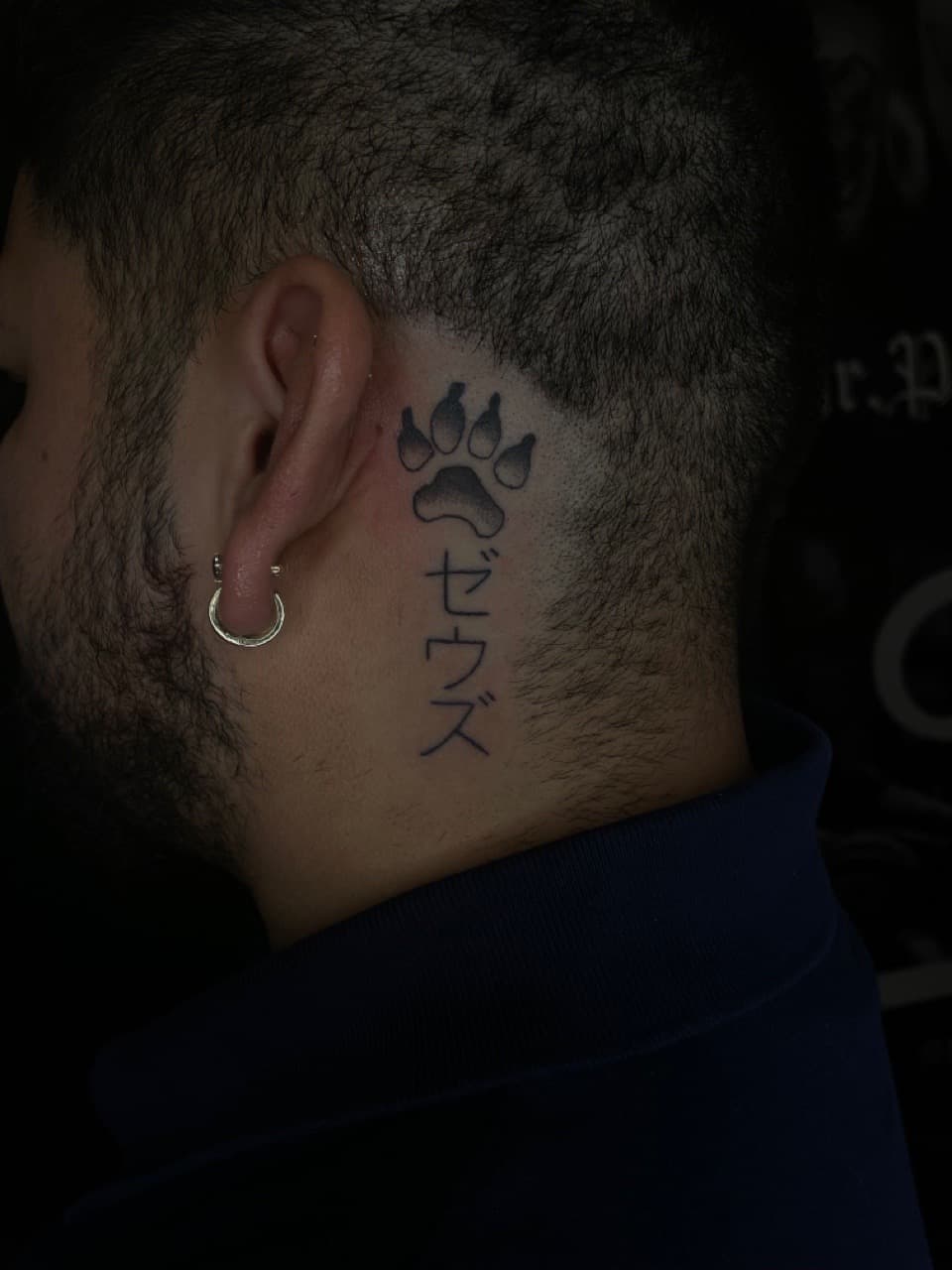 Black & Grey + Lettering paw print tattoo on Behind Ear by Dark_Alchemy_Studios on TattMe