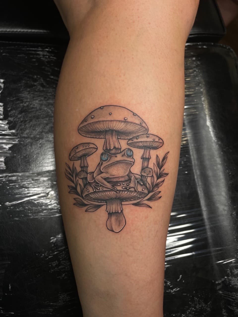 Black & Grey + Illustrative frog tattoo on Calf by Dark_Alchemy_Studios on TattMe
