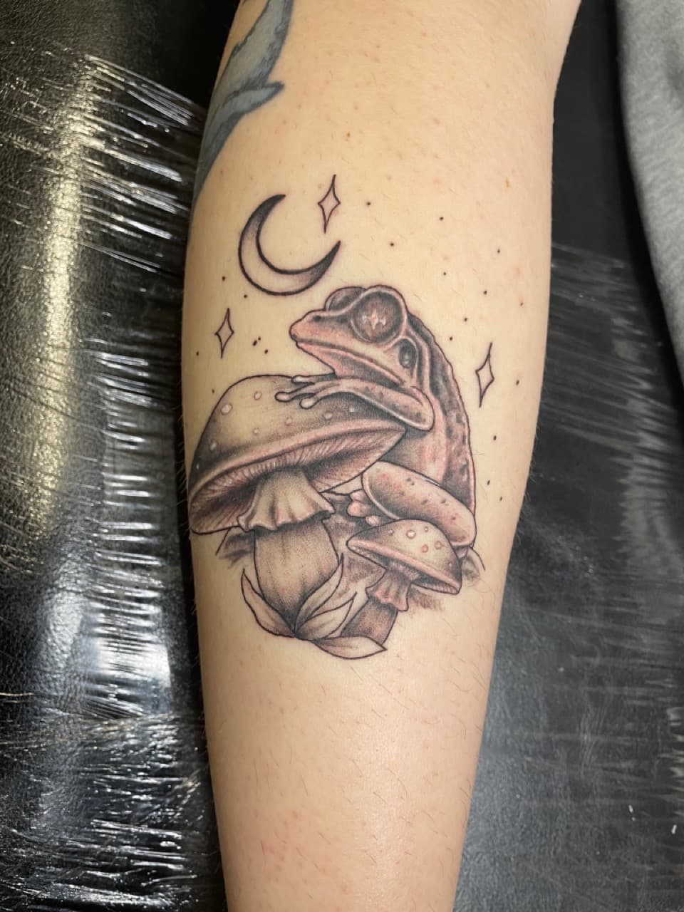 Black & Grey + Illustrative frog tattoo on Calf by Dark_Alchemy_Studios on TattMe