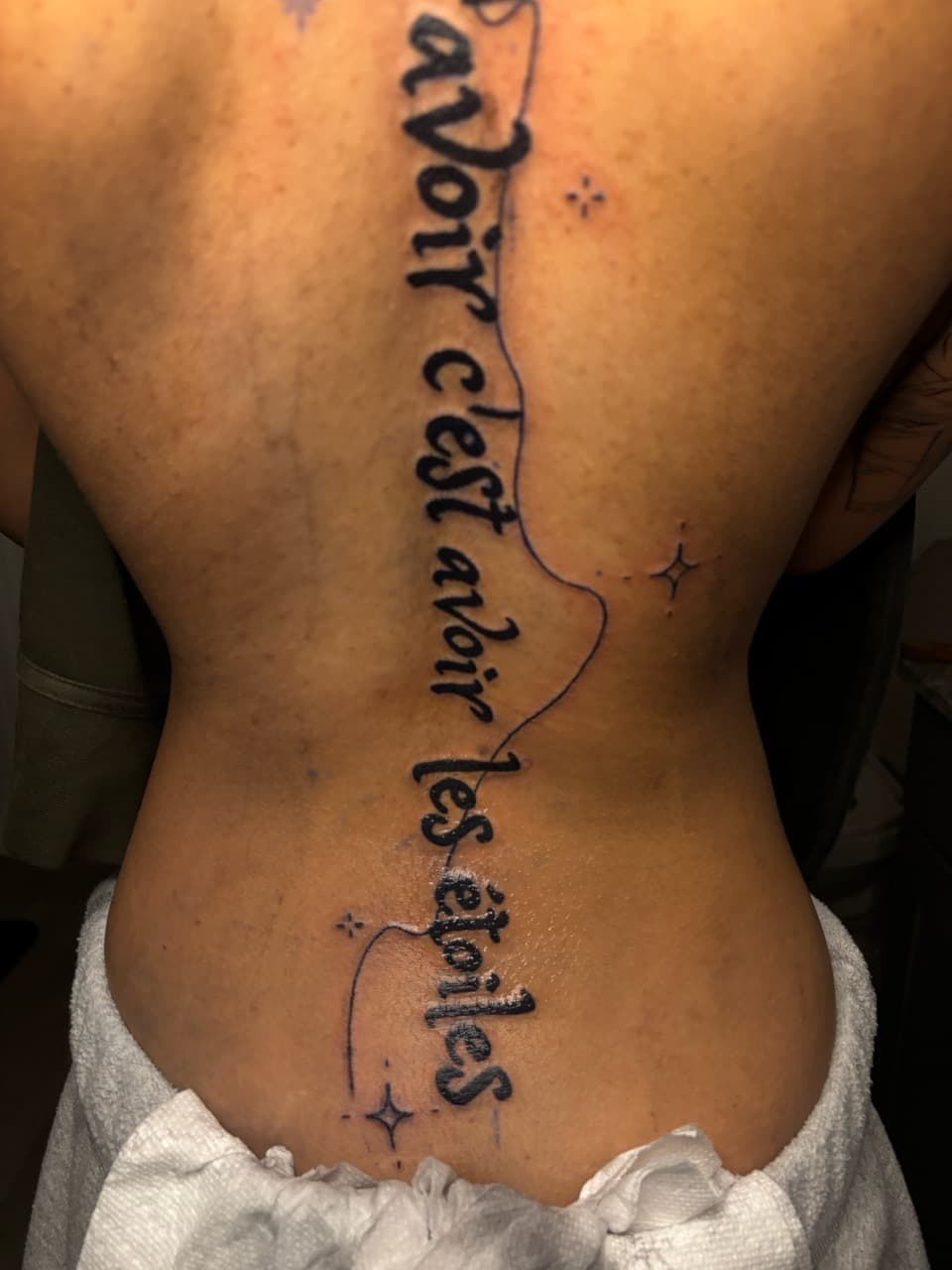 Lettering + Script stars tattoo on Spine by 33_Tattoos on TattMe