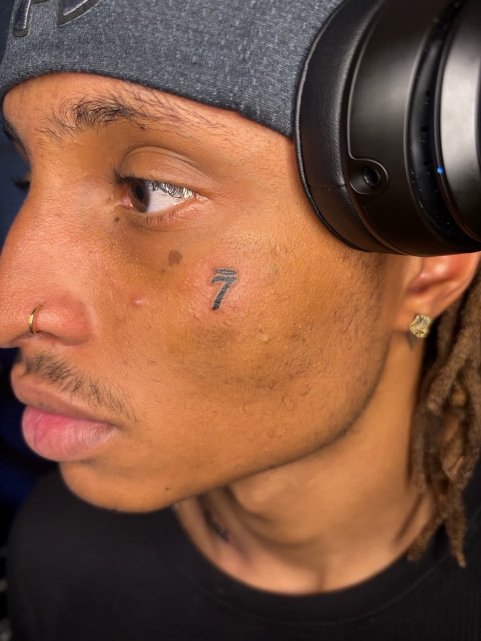 Black-work + Minimalist number tattoo on Face by 33_Tattoos on TattMe