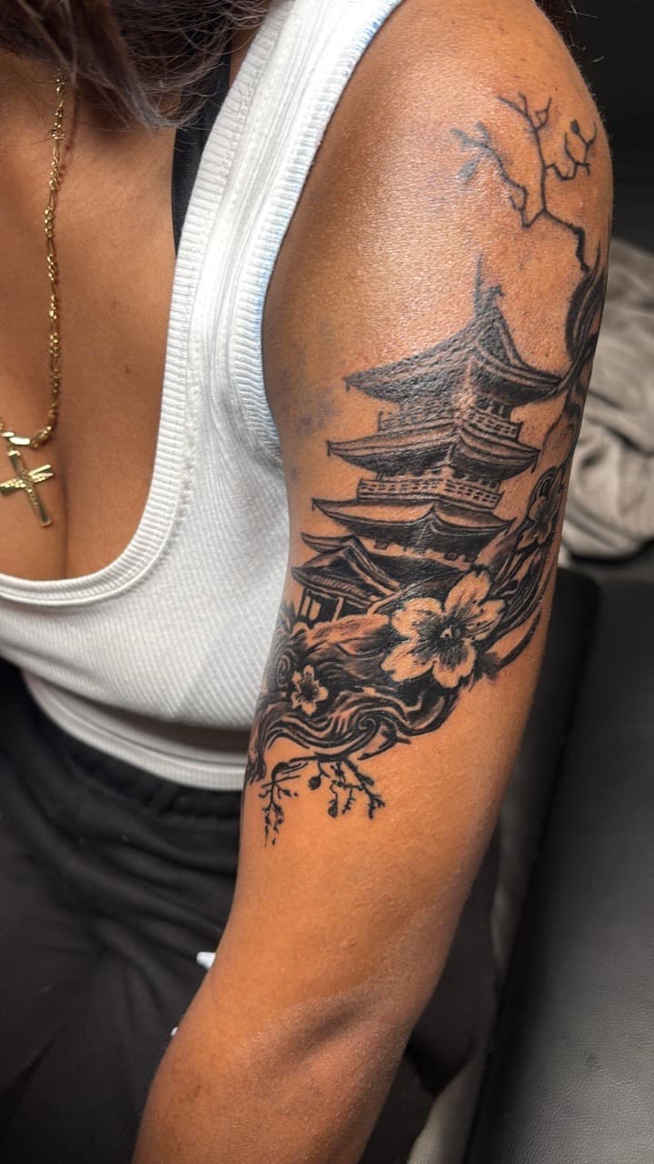 Black & Grey + Illustrative pagoda tattoo on Upper Arm by 33_Tattoos on TattMe
