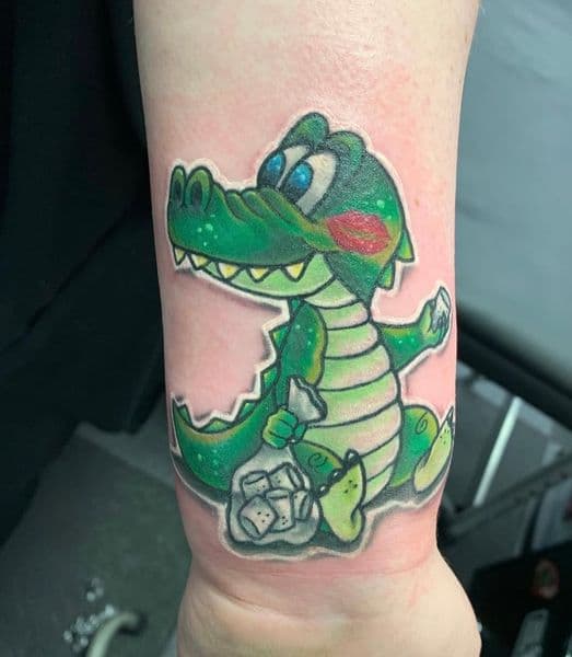 Cartoon + Color alligator tattoo on Wrist by Wraithtattoos on TattMe