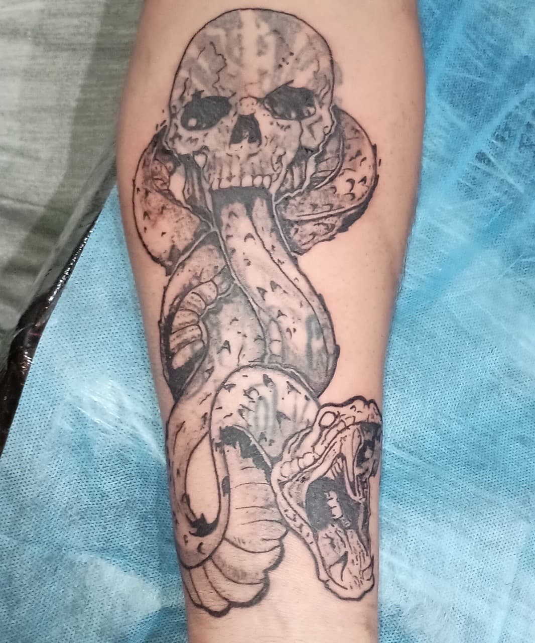 Black & Grey + Illustrative skull tattoo on Forearm by Kingslayer_Tattoo_Parlor on TattMe