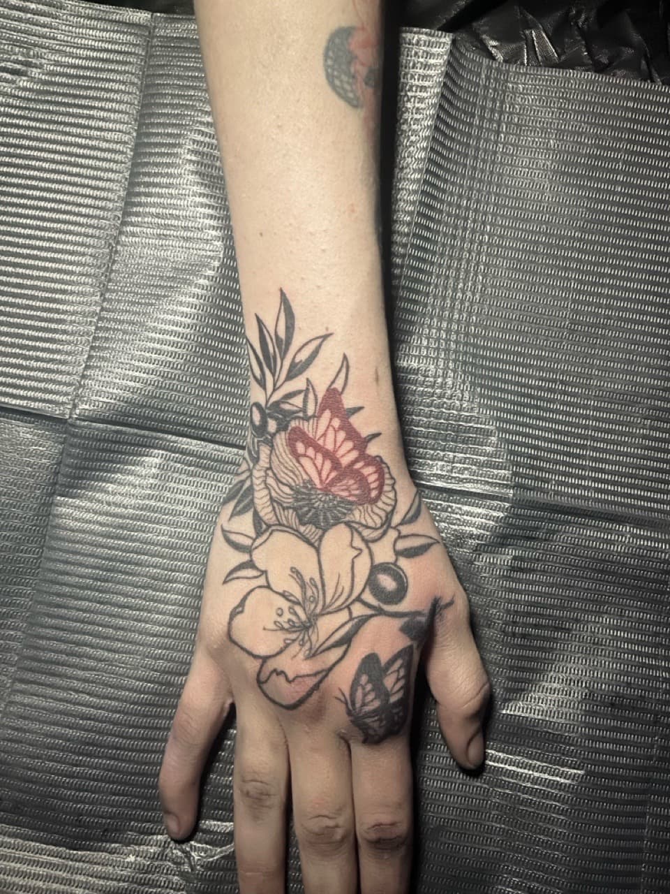Floral + Illustrative flowers tattoo on Hand by Kingslayer_Tattoo_Parlor on TattMe