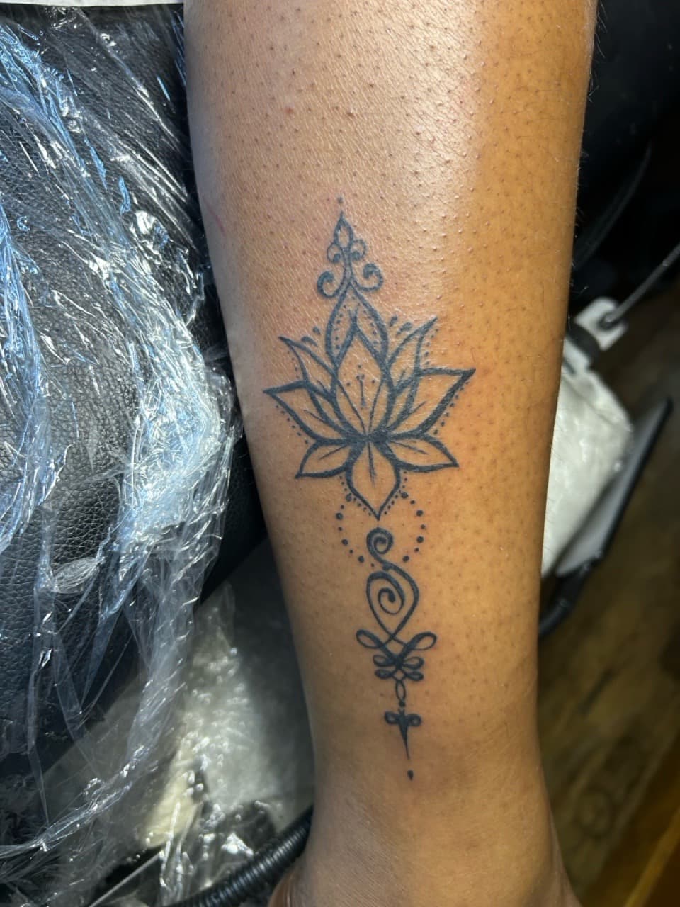Fine Line + Black-work lotus tattoo on Forearm by Kaapt3ntattoos on TattMe
