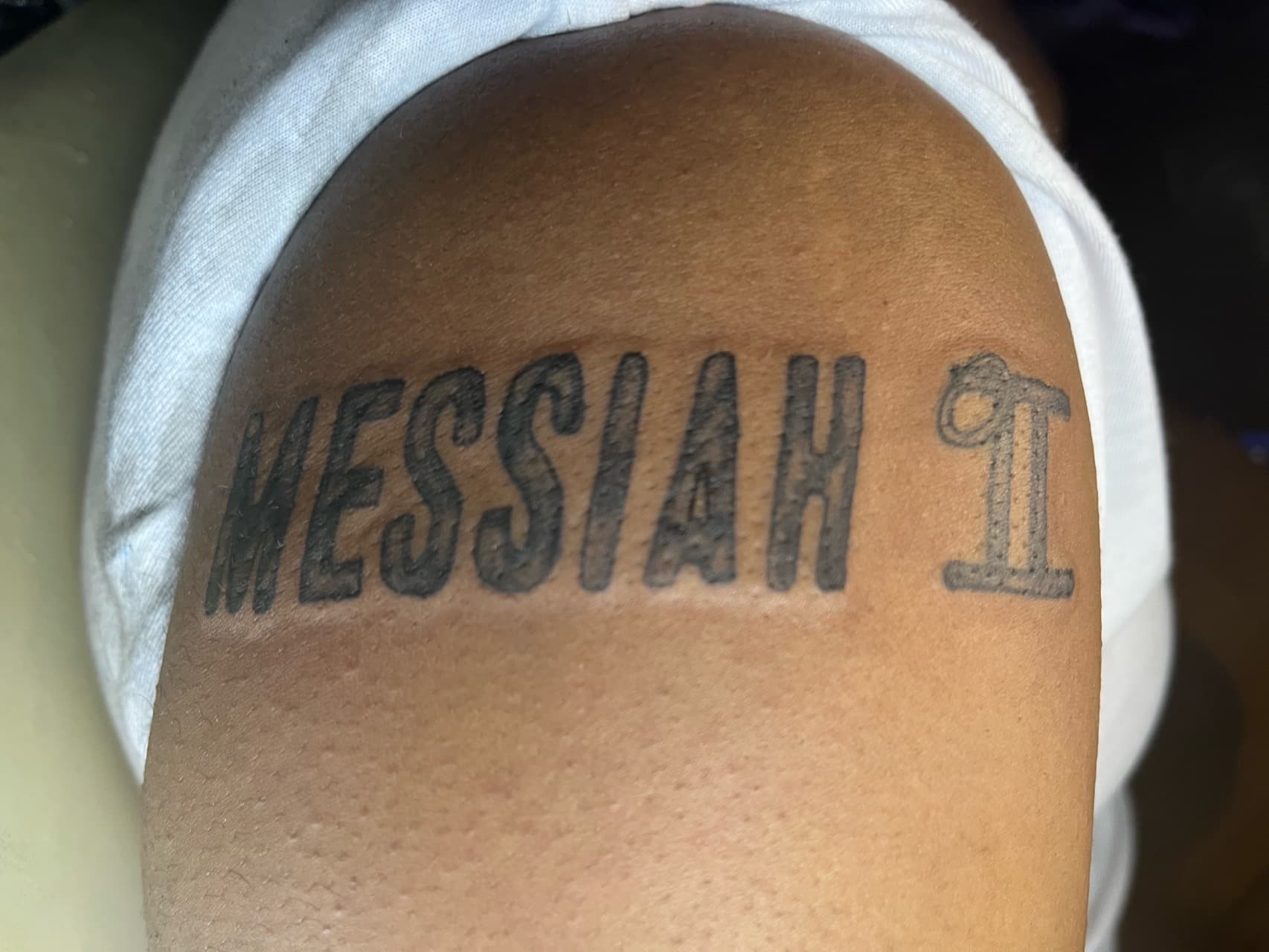 Lettering + Black-work messiah tattoo on Upper Arm by Kaapt3ntattoos on TattMe
