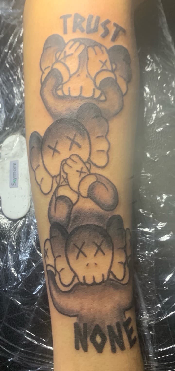 Black & Grey + Pop Culture kaws tattoo on Forearm by Kaapt3ntattoos on TattMe