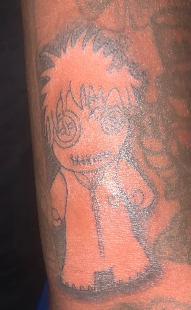 Illustrative + Black-work doll tattoo on Upper Arm by Kaapt3ntattoos on TattMe